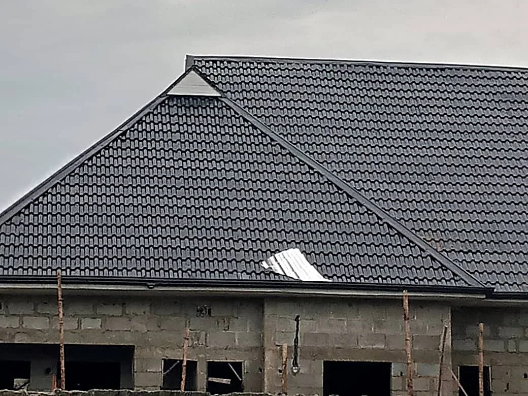 Close-up of a finished hip roof, stone-coated tile