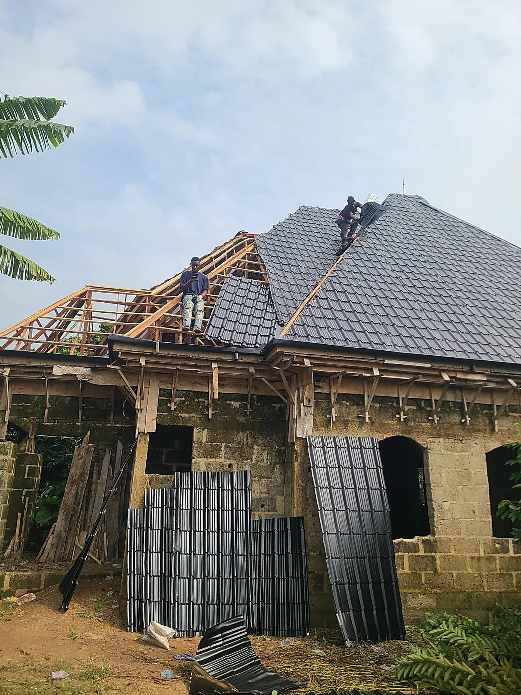Installer at work on a duplex tile roof